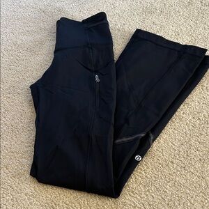 Lululemon boot cut black leggings.  Size 4.